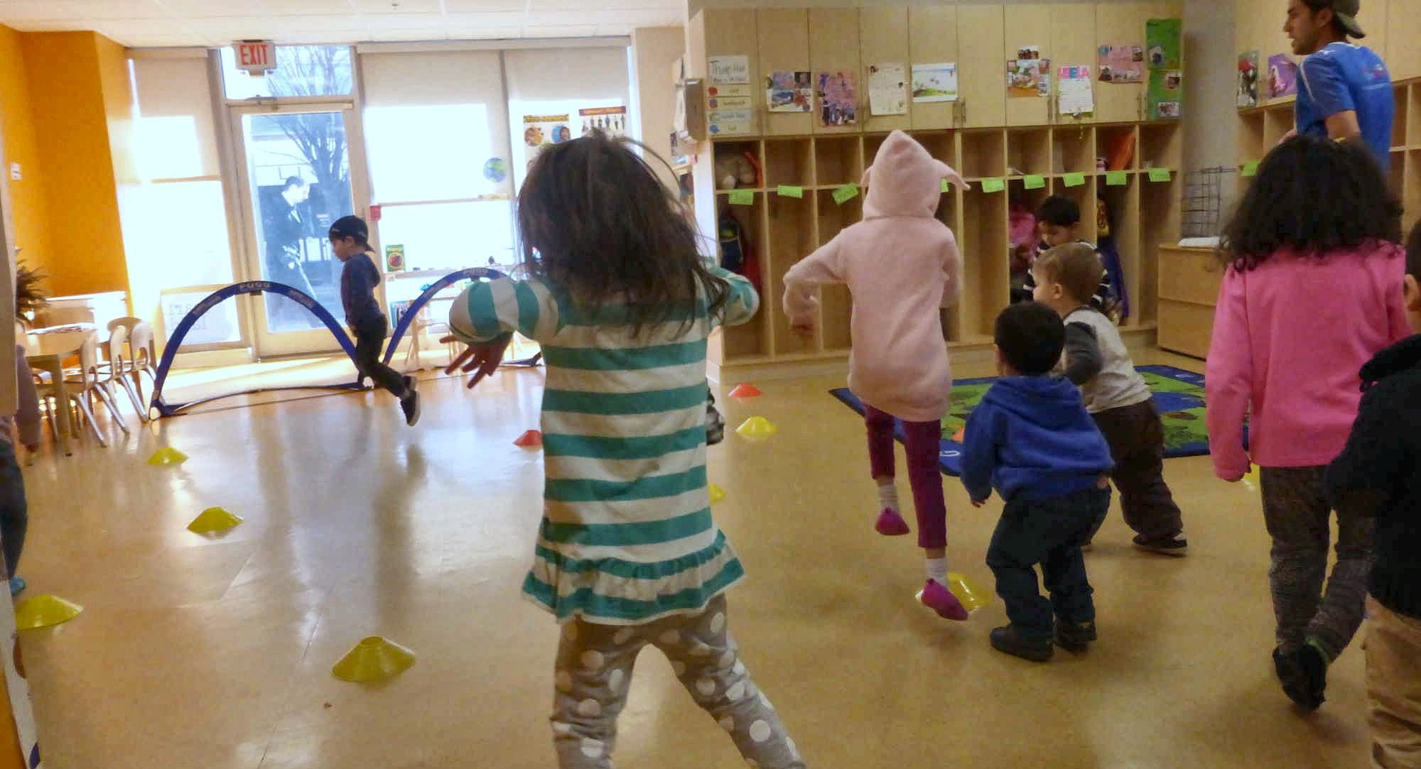 A Learning Ladders classroom with staff and children mid-activity